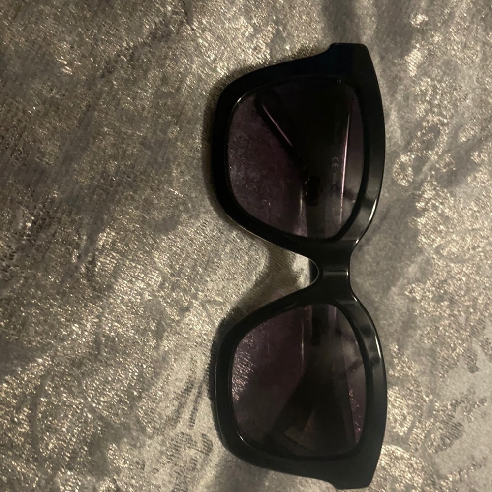 Black modern cat eye sunglasses by ferregamo